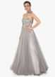 Grey strapless gown in net with 3D flower embroidered bodice