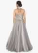 Grey strapless gown in net with 3D flower embroidered bodice