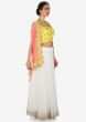 Hand embroidered bright yellow and light peach jacket lehenga set only on Kalki