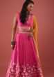 Hot Pink Silk Stone Embellished Lehenga And Blouse With Floral Print And Colorful Embellishments On It's Hem