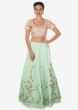 Ice blue lehenga with pink embroidered blouse adorn in gotta patch and moti work only on Kalki