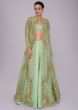 Irish green raw silk skirt and blouses paired with long net embroidered jacket