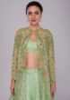 Irish green raw silk skirt and blouses paired with long net embroidered jacket