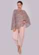Ivory dhoti pant paired with cape top in print and scallop border