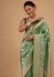 Kalki Atlantis Green Saree In Pure Banarasi Silk With A Summer Green Luminous Shade And Upada Zari Weave Floral Jaal Work