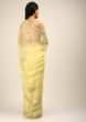 Lemon Yellow Saree In Organza With Multi Colored Applique Flowers On The Border And Cut Dana Accents  