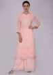 Light peach suit set in self thread embroidered butti and border 