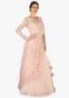 Light Peach gown in georgette with ready pleated pallav embellished with moti work only on Kalki