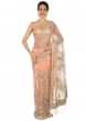 Light peach saree in net with resham and velvet floral embroidery