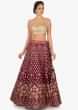 Magenta lehenga in silk featuring the foil print butti embroidery work only on Kalki