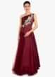 Maroon satin floor length top paired with matching net skirt in satin lining