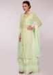 Mint green cotton skirt paired with embroidered long jacket and matching chiffon dupatta