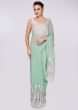 Mint green georgette saree having lower bottom in floral resham embroidery