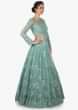 Mint Blue gown in net crafted heavily using the thread and moti embroidered