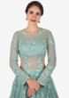 Mint Blue gown in net crafted heavily using the thread and moti embroidered