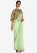 Mint blue saree with a fancy cape embellished in resham and zari embroidery work only on Kalki