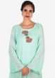 Mint green kurti in cotton adorn in french knot floral motif embroidery only on Kalki