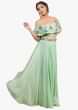 Mint green lehenga matched with off shoulder embroidered cape 