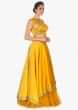 Mustard cut out crop top with satin skirt having under layer in net