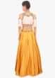 Mustard skirt paired with light peach cold shoulder crop top 