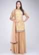Ochre yellow embroidered short kurti and palazzo suit set only on Kalki