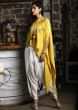 Off white dhoti pant and crop top paired with embroidered mustard kaftan 