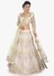 Off white embellished satin net lehenga and  blouse paired with a light green net dupatta