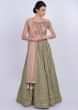 Olive green self thread lehenga with dusty rose pink embroidered blouse and net dupatta only on Kalki