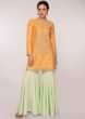 Orange cotton silk embroidered suit with mint green sharara pant and net dupatta 