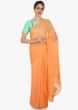 Orange crepe saree showcasing the thread gotta butti work only on Kalki