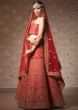 Ox red lehenga with unstitched blouse in gotta patch and zari embroidery
