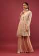 Pastel Peach Sharara And Peplum Suit With Lucknowi Thread Embroidered Floral And Paisley Jaal  