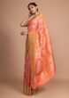 Peach art handloom Saree In Silk With Weaved Floral Jaal And Colorful Floral Border