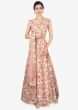 Peach raw silk embroidered lehenga and blouse paired with net dupatta