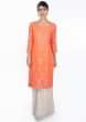 Peach zari embroidered suit paired with off white weaved palazzo and matching chiffon dupatta 