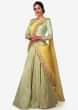 Light green brocade lehenga with a ready styled dupatta in yellow only on Kalki