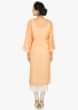 Peach dress in crush cotton enhanced in resham embroidery only on Kalki