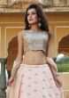 Peach lehenga in raw silk with contrast blouse in french knot and kundan embroidery only on Kalki