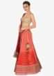 Orange and coral shaded lehenga matched with a coral brocade blouse and georgette lace dupatta only on kalki