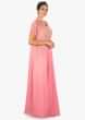 Pink sleeveless top embossed in  moti and zardosi paired with a crepe jacket in cut dana and tassel motifs only on Kalki