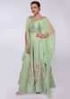 Pista green anarkali gown teamed with a cowl draped wrap around only on Kalki