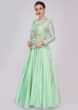 Pista green cotton anarkali dress styled with matching floral embroidered organza jacket