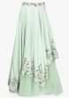 Pista green  lehenga paired with halter neck embroidered blouse and pink net dupatta