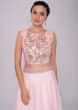 Powder pink lehenga and embroidered crop top with layered net jacket