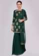 Rama green sharara paired with matching suit in sequins and zardosi butti
