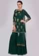 Rama green sharara paired with matching suit in sequins and zardosi butti
