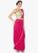 Rani pink pre stitched pleated saree with a turq green strap blouse