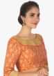 Rust brocade blouse in sequins and zari jewel neckonly