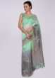 Sea green and grey shade cotton saree in  floral  butti 