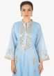 Sky blue A line dress adorn in gotta lace embroidered placket and butti